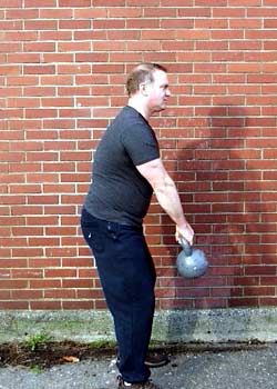 As the hips begin to extend note the arms stay