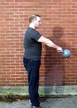 Top position: Hips fully extended, body tall - arms still